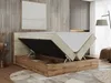 A bed with its storage compartment open, showing the mattress and the wooden frame. Produktbild-Vorschau