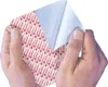 Hands peeling back a protective layer from a medical dressing or bandage. Anteprima dell’immagine prodotto