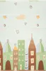A colorful play mat with a city theme, featuring buildings, letters, and animals. Produktbild-Vorschau