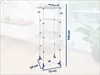 A multi-tiered drying rack is shown in a room with a blurred background. Produktbild-Vorschau