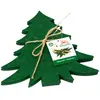 A stack of green felt Christmas tree-shaped cutlery holders tied with twine, with a product tag attached. Produktbild-Vorschau