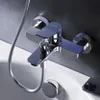 A close-up shot of a chrome bathtub faucet mounted on a wall above a white bathtub. Produktbild-Vorschau
