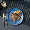 A plate of food on a table with text on the placemat. Náhled obrázku produktu