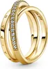 A close-up studio shot of a gold ring with clear stones. Náhled obrázku produktu