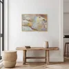 A framed abstract painting hangs on a white wall above a wooden bench. A woven stool sits to the left of the bench, and a vase sits on the bench. Náhled obrázku produktu