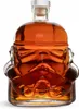 A glass bottle shaped like a Stormtrooper helmet, filled with a brown liquid. Produktbild-Vorschau