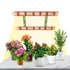 A grow light setup with multiple potted plants displayed on a surface. Náhľad obrázku produktu