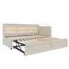 A beige sofa bed with its pull-out mattress frame extended, showing storage shelves in the headboard. Náhled obrázku produktu