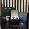 A product shot of a watch set in its packaging, with a shopping bag and an additional watch box in the background. Náhled obrázku produktu
