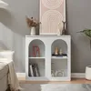 A white sideboard with arched openings is shown in a living room setting, next to a sofa and a plant. Anteprima dell’immagine prodotto