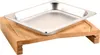 A stainless steel food pan rests on a bamboo cutting board. Anteprima dell’immagine prodotto