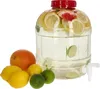 A large clear plastic beverage dispenser filled with water and citrus slices, with whole citrus fruits in front of it. Produktbild-Vorschau