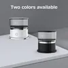 Two coffee makers, one white and one black, are displayed on a white surface against a gray background. Podgląd zdjęcia produktu