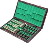 An open chess set with pieces arranged inside. Produktbild-Vorschau