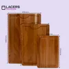 Three wooden cutting boards of different sizes are arranged diagonally, with dimensions indicated by dotted lines and text. Produktbild-Vorschau