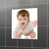 A baby crawling on a white background, with a tiled gray background visible on the sides. Anteprima dell’immagine prodotto