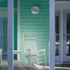 A white rocking chair and side table on a porch with turquoise siding and light blue doors. Anteprima dell’immagine prodotto