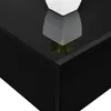 A close-up view of the corner of a black, high-gloss shelf with a white pot and green plant on it, showing the reflection. Voir les images du produit