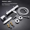 A collection of bathroom faucet and shower components laid out on a dark, reflective surface. Náhľad obrázku produktu