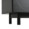 A close-up view of the bottom section of a black TV cabinet, showing its legs and the underside. Produktbild-Vorschau