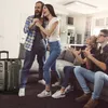 A group of friends are enjoying karaoke at home. Produktbild-Vorschau