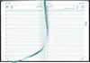An open planner showing a daily schedule layout. Voir les images du produit
