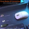 A white gaming mouse is shown on a dark, reflective surface with text overlays describing its connection modes. Podgląd zdjęcia produktu