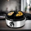 A close-up shot of an electric egg cooker with two dishes of cooked food. Produktbild-Vorschau