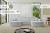 A modern living room with a large U-shaped sofa. Produktbild-Vorschau