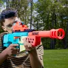 A young person is holding and aiming a toy gun outdoors. Produktbild-Vorschau
