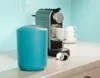 A teal trash can and a coffee machine are on a kitchen counter. Produktbild-Vorschau