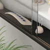 A close-up view of a display case with jewelry and decorative items. Podgląd zdjęcia produktu