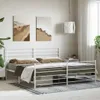 A white metal bed frame with mattresses and bedding in a bedroom setting. Náhľad obrázku produktu