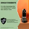 A Nespresso coffee machine next to text about its usage. Produktbild-Vorschau