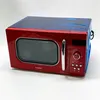 A red Comfee microwave oven is shown against a white background. The top of the microwave is covered in blue plastic wrap. Anteprima dell’immagine prodotto