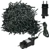 A pile of green LED cluster lights with a black power adapter and plug. Podgląd zdjęcia produktu