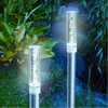 Two solar-powered garden lights with air bubbles inside, set in a garden at dusk. Produktbild-Vorschau