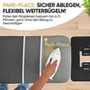 A hand is placing a white iron onto a gray ironing board with a "Park-Place" logo. A black accessory is attached to the side of the ironing board. Produktbild-Vorschau