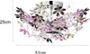 A close-up studio shot of a decorative ceiling lamp with floral elements. Náhled obrázku produktu