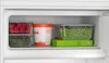 Inside of a refrigerator drawer with food items. Produktbild-Vorschau