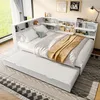 A white bed with a pull-out trundle bed, set up in a room with a window and some wall decor. Produktbild-Vorschau
