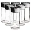 A group of empty spice jars with black and silver lids. Produktbild-Vorschau