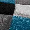 A close-up, textured view of a rug with a geometric pattern. Anteprima dell’immagine prodotto