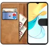 A wallet-style phone case with a phone inserted, showing cards and banknotes inside. Produktbild-Vorschau