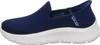 A side view of a blue Skechers slip-on sneaker with a white sole. Produktbild-Vorschau