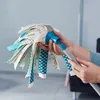 A person is holding a mop head and attaching a handle to it. Náhľad obrázku produktu