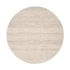 A round rug with a textured pattern. Produktbild-Vorschau