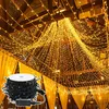 A room decorated with many strings of warm white LED lights hanging from the ceiling. Voir les images du produit