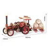 A wooden model of a steam engine with a trailer carrying barrels, shown on a white background with dimensions indicated. Voir les images du produit