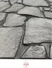 A close-up view of textured stone-like wall panels. Náhled obrázku produktu